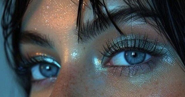 woman with blue eyes and long eyelashes